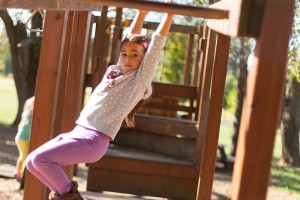 girl swinging at CMH School in Loveland, Ohio